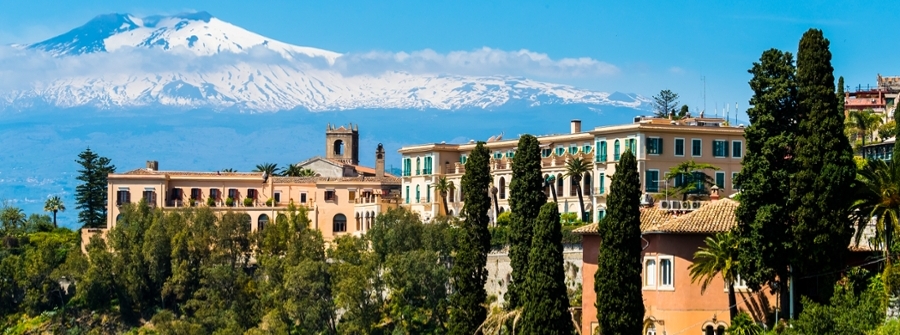 3 of 4, Italy, Sicily, Taormina, view to hotel with Mount Etna in the background