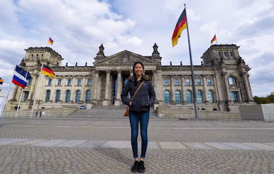 student poses in front of the Reichstag